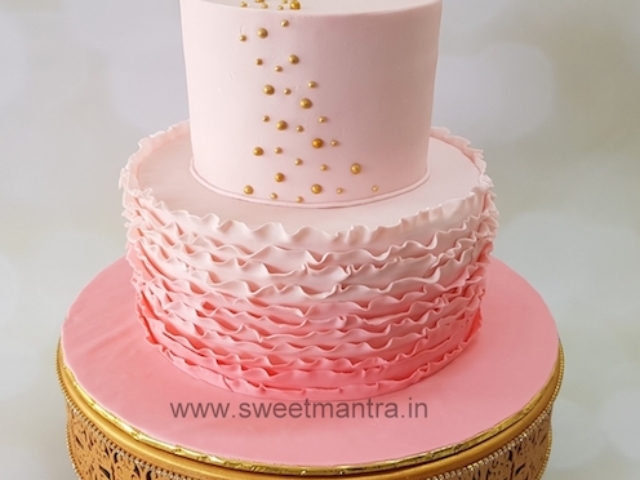 Customized 2 layer fondant cake in shades of pink for girl's 1st birthday in Pune