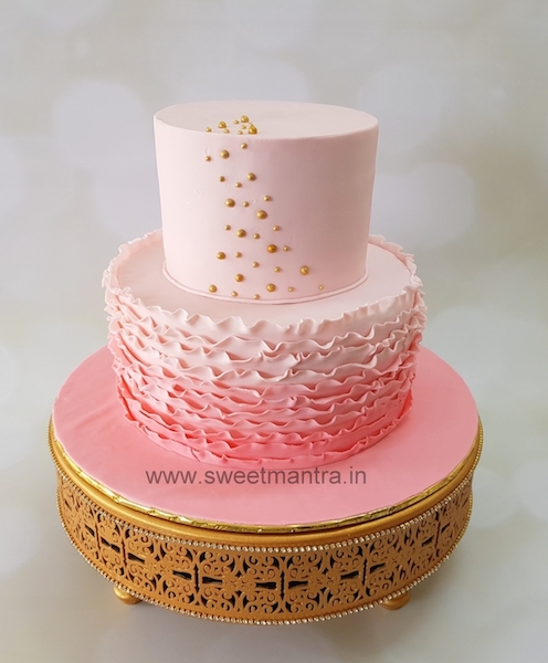 Customized 2 layer fondant cake in shades of pink for girl's 1st birthday in Pune