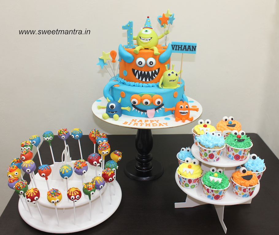 Cute Monsters theme colorful dessert/sugar table with fondant cake, cupcakes and cakepops for boy's 1st birthday in Pune