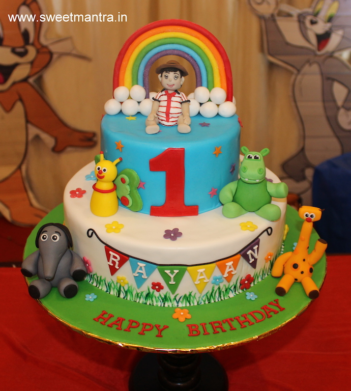 Baby TV theme 2 tier colorful customized cake for boy's 1st birthday in Pune