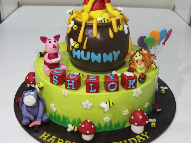 Winnie the pooh animals theme 2 layer fondant cake for 1st birthday in Pune