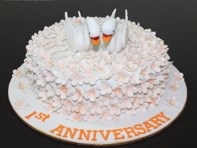 Peach flowers theme customized cake for 1st anniversary in Pune