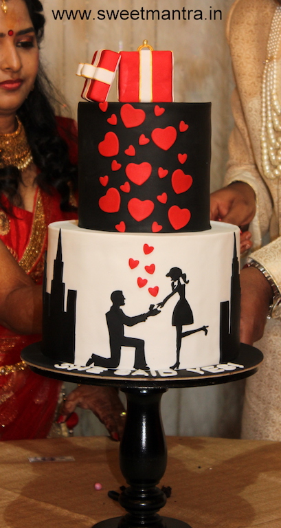 Boy proposing girl theme 2 tier designer cake for Engagement in Pune