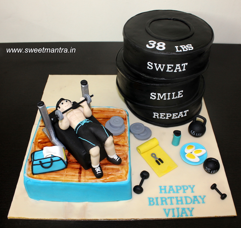 Gym theme cake with body builder working out in Pune