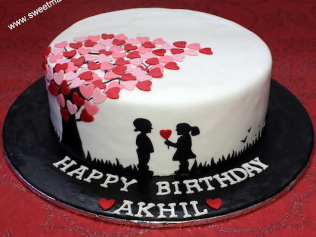 Love theme customized cake with cute boy and girl in Pune