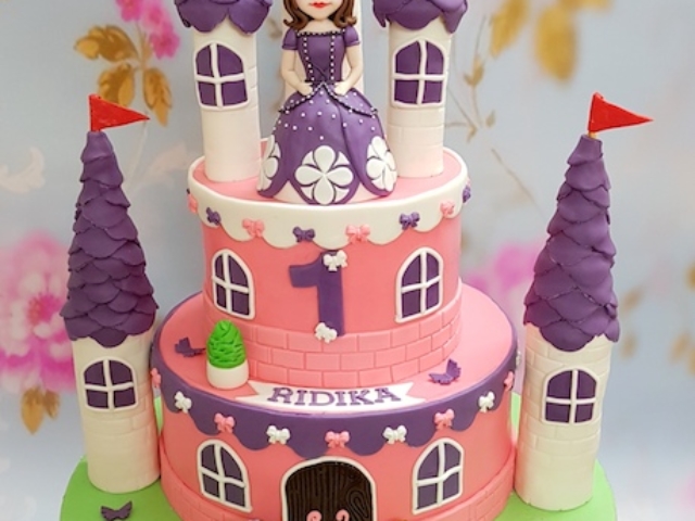 Princess Sofia Castle theme 2 tier fondant cake for girl's 1st birthday in Pune