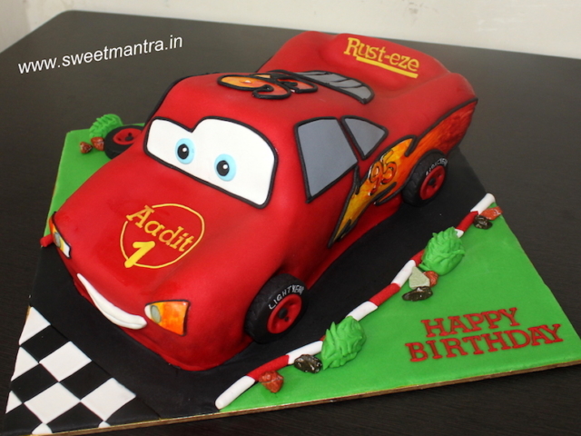 McQueen car shaped theme 3D fondant cake for 1st birthday in Pune