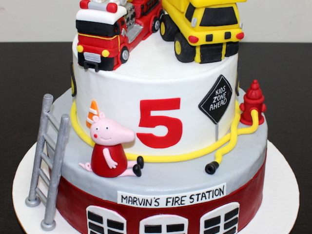Fire engine and dump truck theme 2 layer fondant birthday cake in Pune