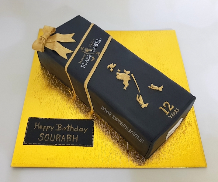 Black Label whiskey bottle shaped 3D cake for husband's birthday in Pune