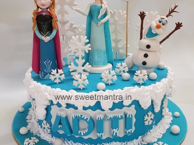 Frozen theme designer cake with edible Elsa, Anna figurines for girls birthday in Pune