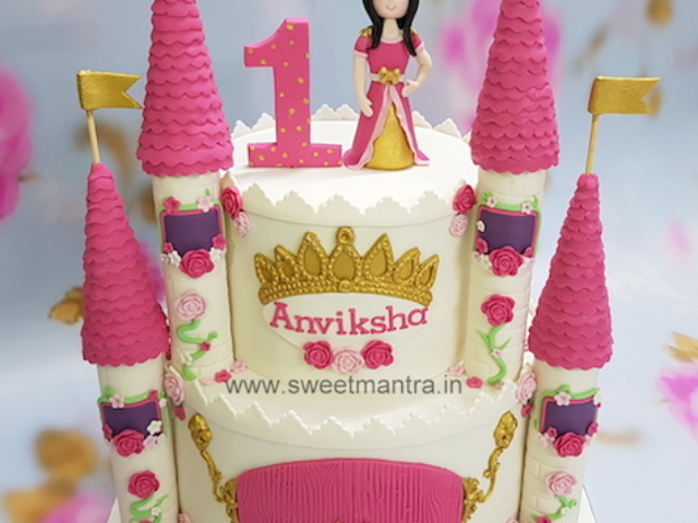 Pink and Gold theme 2 tier Princess Castle cake for girl's 1st birthday in Pune