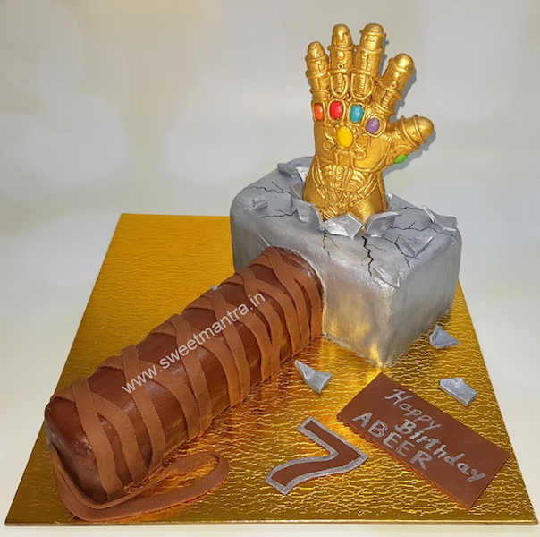 Thanos tearing Thor Hammer shaped 3D cake for boy's birthday in Pune