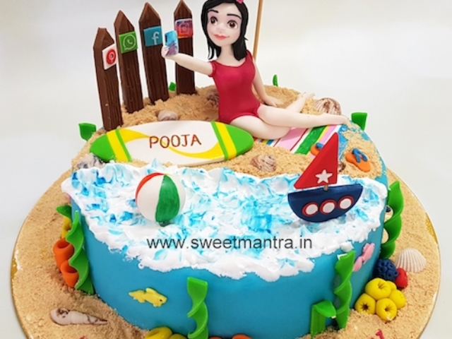 Girl taking selfie on beach theme customized fondant cake for wife's birthday in Pune