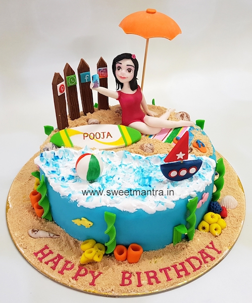 Girl taking selfie on beach theme customized fondant cake for wife's birthday in Pune