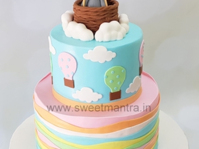 Hot air balloon theme 2 tier designer cake with pastel colors for baby shower in Pune
