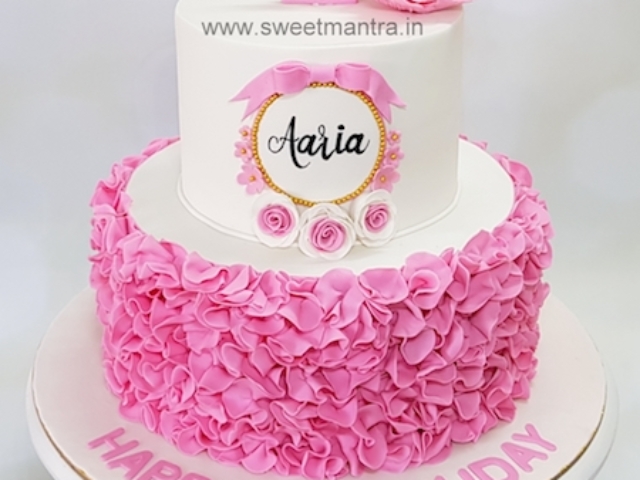 Ruffles theme 2 tier fondant cake for girls 1st birthday in Pune
