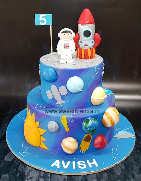 Galaxy theme handpainted cake with planets and rocket in Pune
