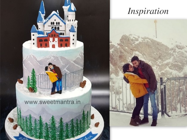 Winter theme hand painted wedding cake with Germany's Neuschwanstein Castle topper in Pune