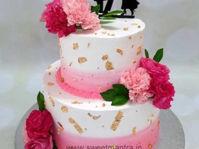 Engagement theme 2 tier designer cake with real flowers