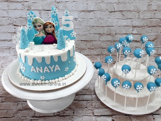 Frozen theme dessert table with cake and cakepops