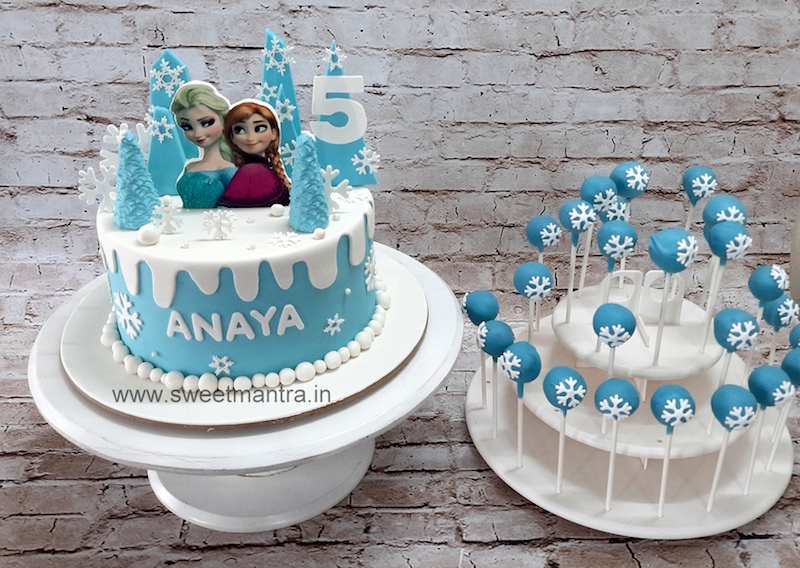 Frozen theme dessert table with cake and cakepops