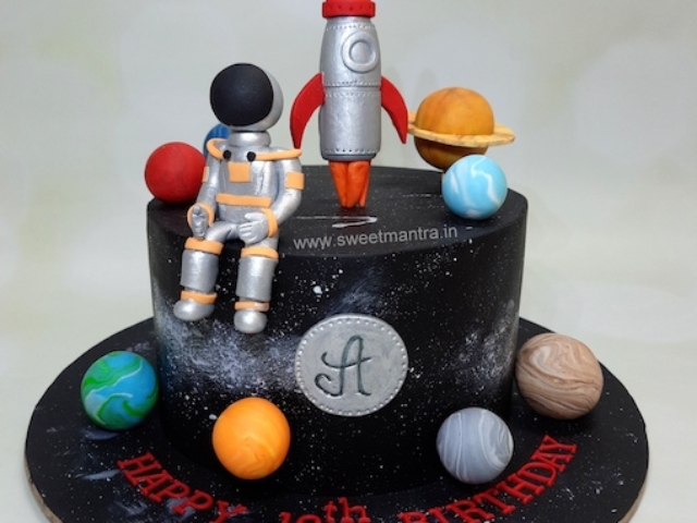 Space theme cake with astronaut and rocket