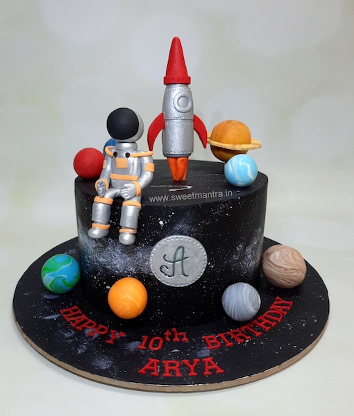 Space theme cake with astronaut and rocket