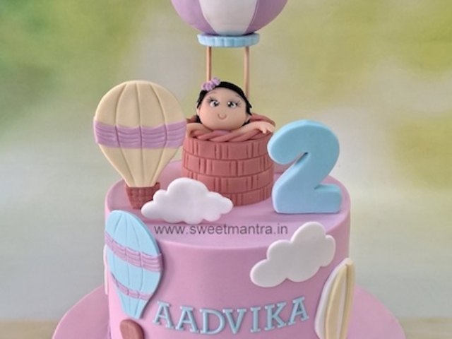 Baby in hot air balloon cake