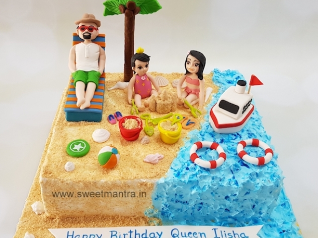 Family on beach theme cake