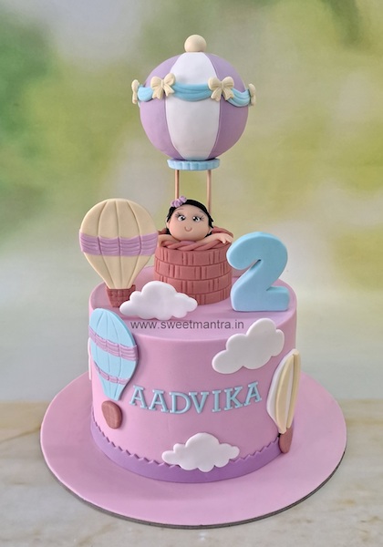 Baby in hot air balloon cake