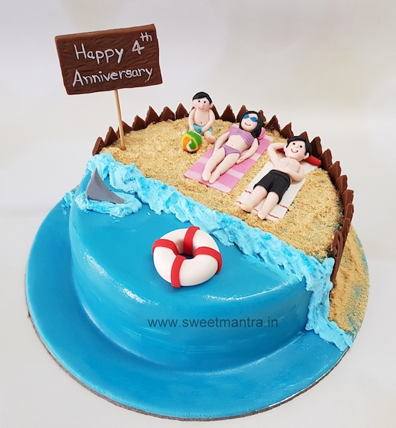 Family on beach cake