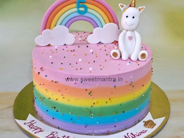 Colorful Unicorn cake in whipped cream
