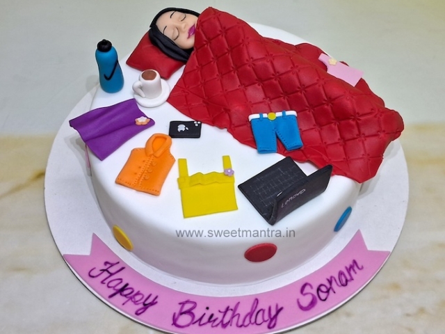 Lazy girl cake with laptop and clothes